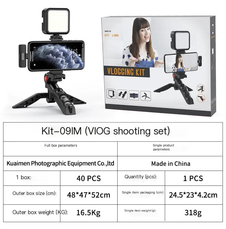 Vlogging kit with smartphone holder, light, and tripod next to its packaging box on a white background.