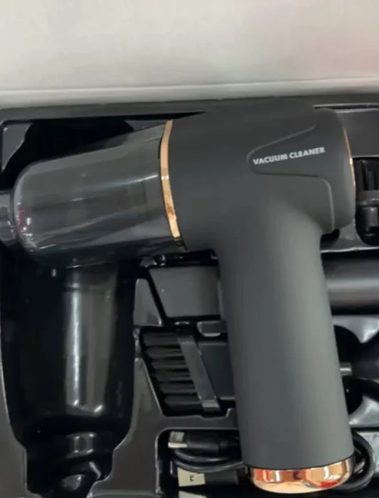 A handheld vacuum cleaner in black color, with crevice nozzle and brush attachments, labeled as '3 in 1 VACUUM CLEANER' with a model number '003'.