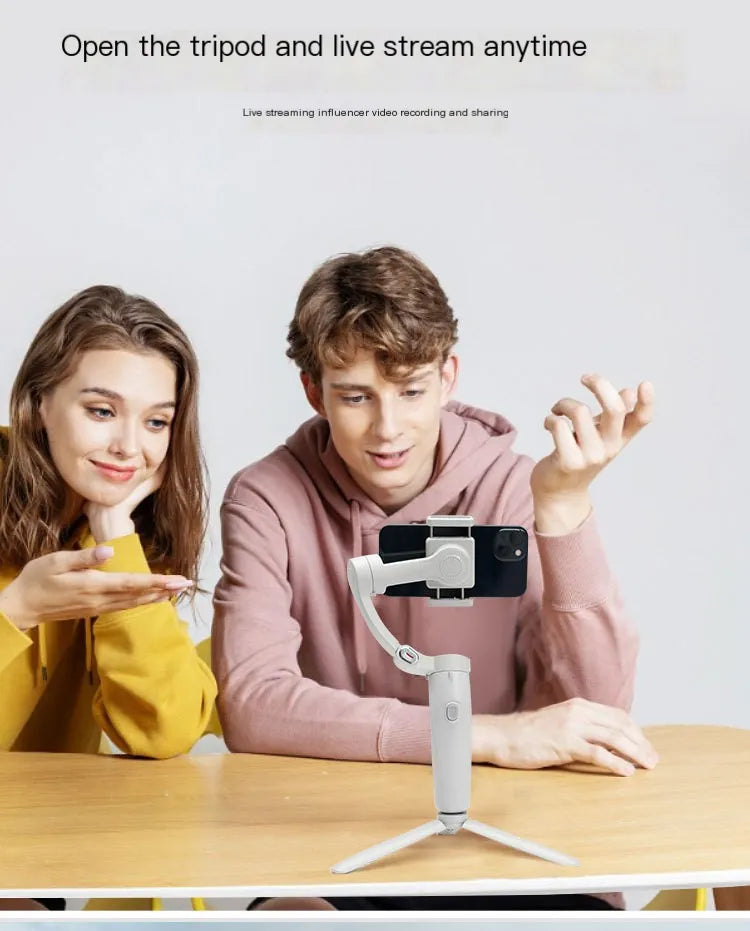 Two people using a smartphone with a tripod stand on a table, with text about live streaming.