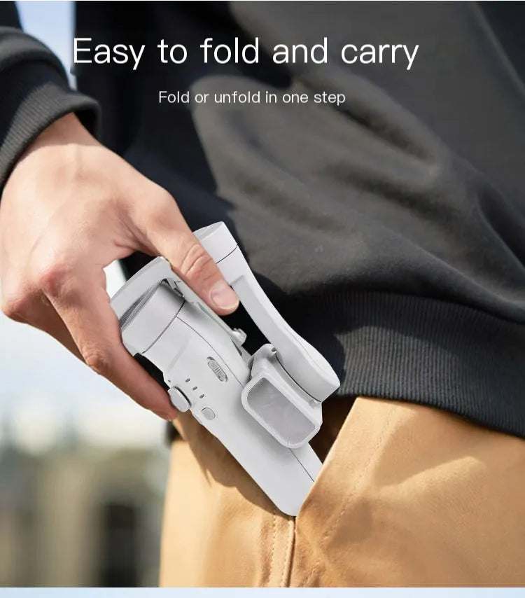 Person holding a white folding device with text 'Easy to fold and carry' on a blurred background