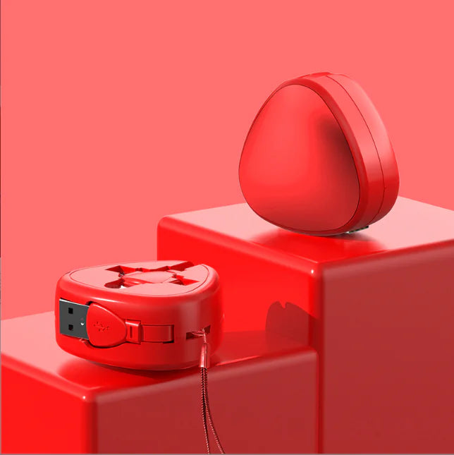 Red portable device on a red platform with a pink background